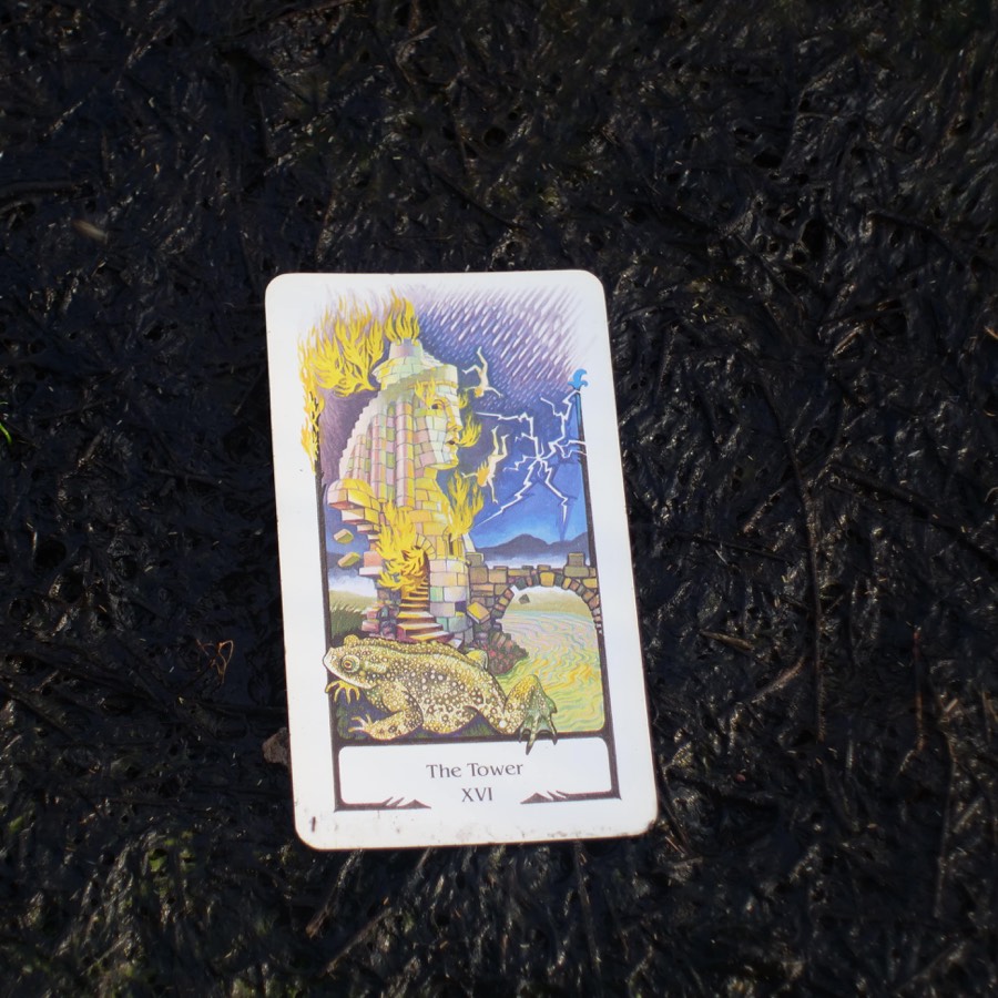 The The Tower tarot card photographed outdoors