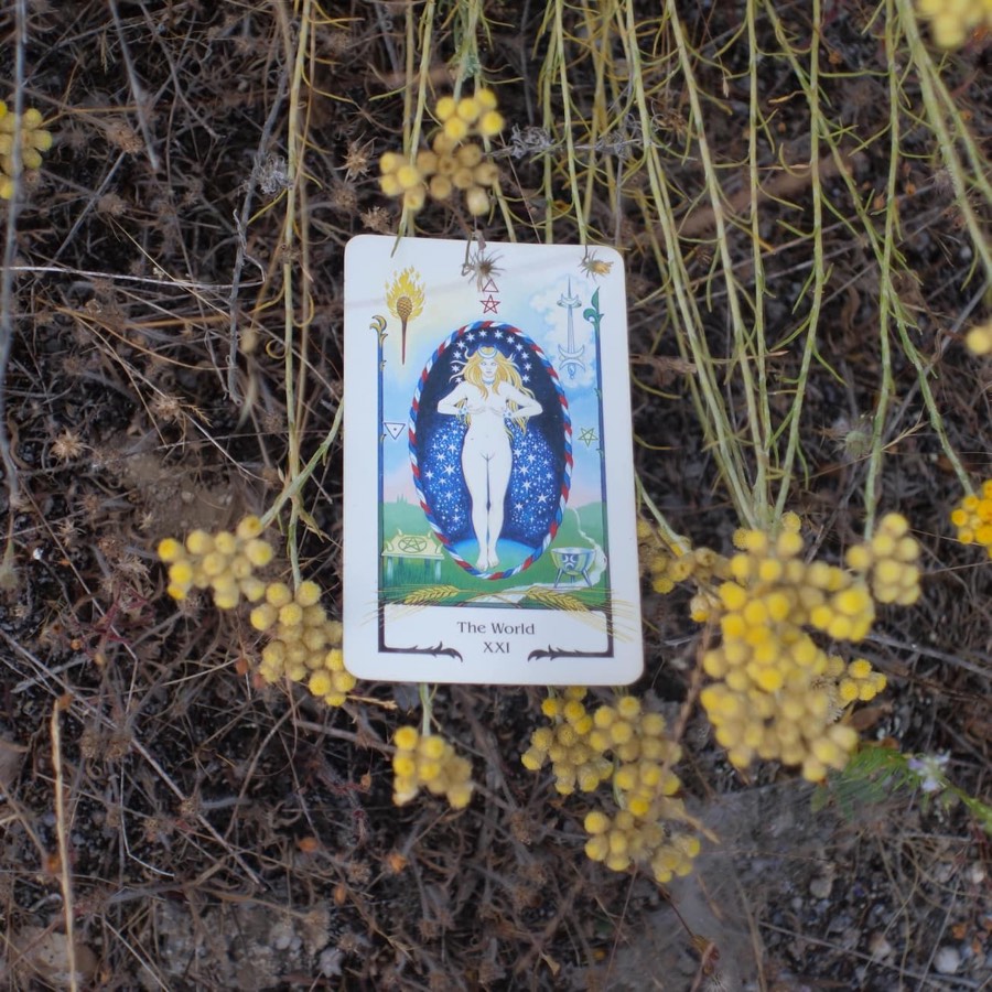 The The World tarot card photographed outdoors