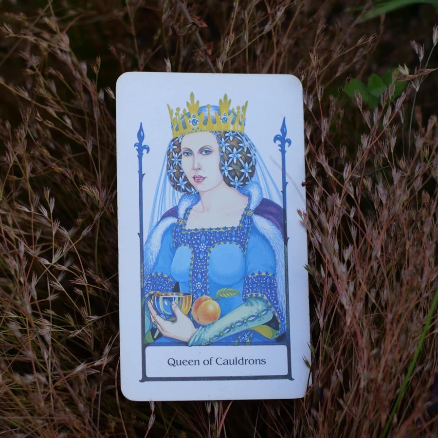 The Queen of Cups tarot card photographed outdoors